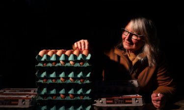 An egg vendor setting up her stall before dawn at a farmers market in 2020 in Auckland. New Zealand is currently undergoing a major egg shortage