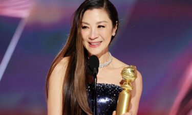 Michelle Yeoh accepts the best actress in a motion picture -- musical or comedy award for "Everything Everywhere All at Once" at the Golden Globe Awards on January 10.