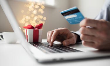 Americans spent a record $212 billion in online shopping this holiday season amid deep discounts.