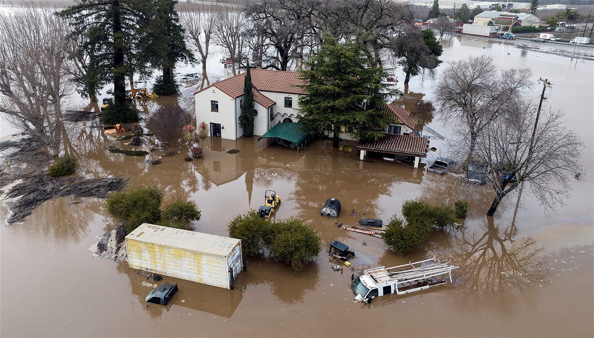 <i>Josh Edel/AFP/Getty Images</i><br/>This aerial view shows a flooded home partially underwater in Gilroy