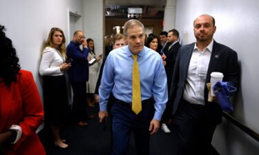 Republican Rep. Jim Jordan (center) of Ohio heads to a GOP conference meeting before the start of the 118th Congress in the basement of the US Capitol Building on January 3 in Washington