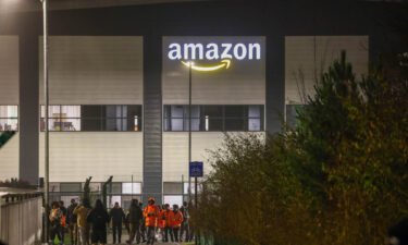 Workers leave at shift change as co-workers strike at the Amazon.com Inc. fulfilment centre in Coventry