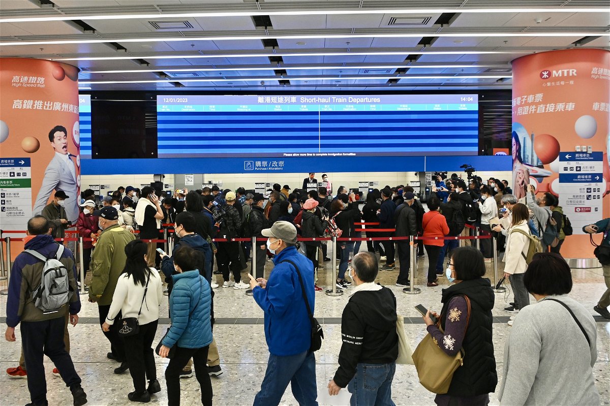 <i>Li Zhihua/China News Service/VCG/Getty Images</i><br/>People line up to buy tickets at Hong Kong's West Kowloon Station on January 12