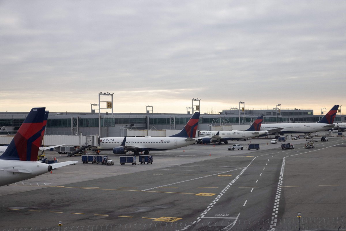 <i>Yuki Iwamura/AFP/Getty Images</i><br/>Grounded Delta Airlines planes are parked at gates at John F. Kennedy International Airport on January 11 in New York.
