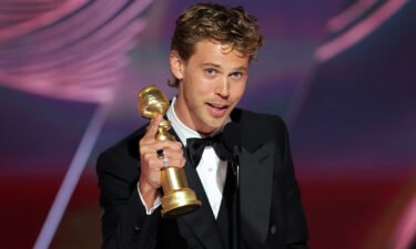 Austin Butler accepts the best actor in a drama motion picture award for "Elvis" at the 80th Golden Globe Awards.