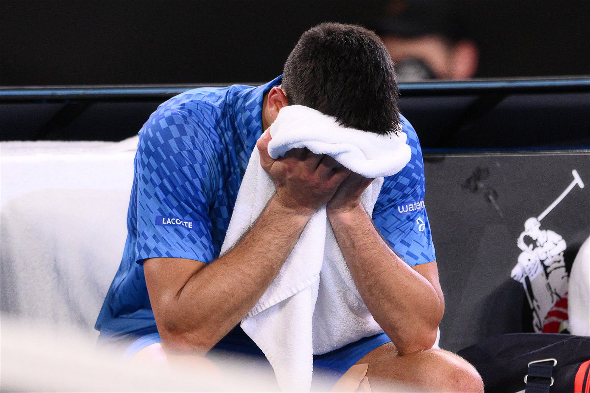 <i>Anadolu Agency/Getty Images</i><br/>Djokovic cries into his towel after victory.