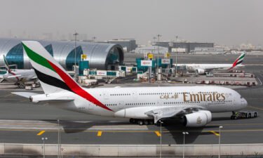 An Airbus A380 operated by Emirates taxis past the terminal at Dubai International Airport in March 2020.