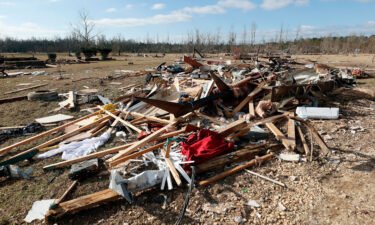 Debris from a tornado that ripped through Central Alabama last week is seen along County Road 140 on Saturday