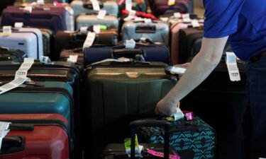 Southwest Airlines employees assist passengers in locating their luggage after U.S. airlines