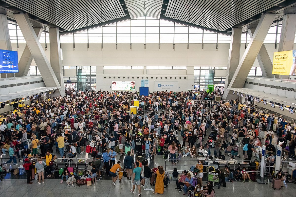 <i>Kevin Tristan/AFP/Getty Images</i><br/>Passengers wait for information about their flights at the of Ninoy Aquino International Airport in Metro Manila
