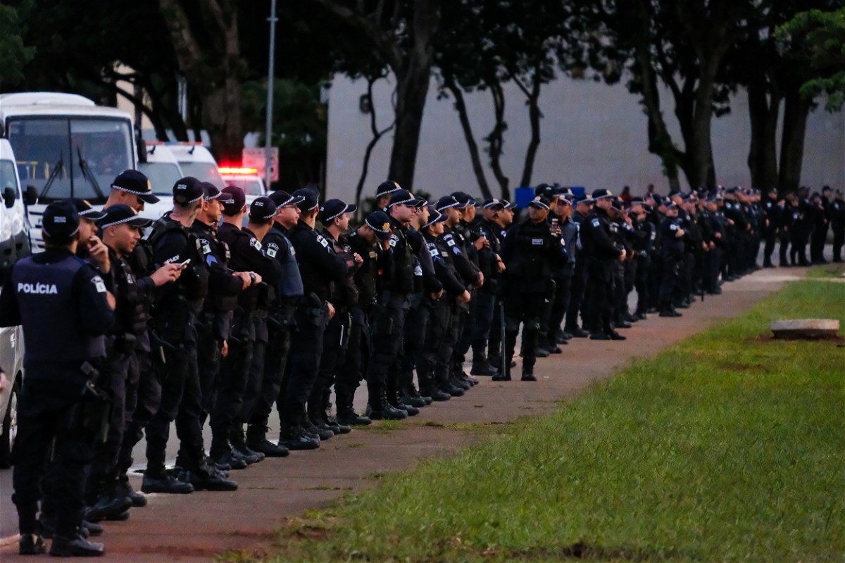 <i>Vasco Cotovio/CNN</i><br/>Police line up in Brasilia on January 11.