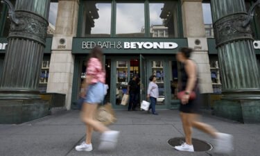 People walk past the entrance to a Bed Bath & Beyond retail store along Sixth Avenue in New York in September of 2022.