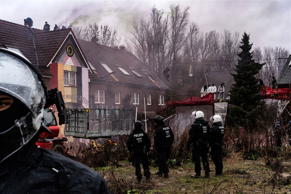 <i>Ben Kilb/Bloomberg/Getty Images</i><br/>Police prepare to enter buildings to remove activists in the condemned village of Lützerath on January 12.