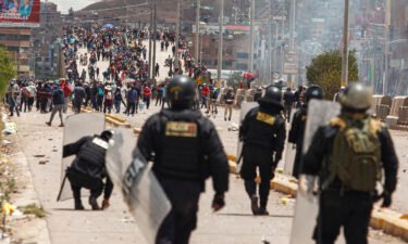 Supporters of ousted president Pedro Castillo clash with police forces in the Peruvian Andean city of Juliaca on January 7.