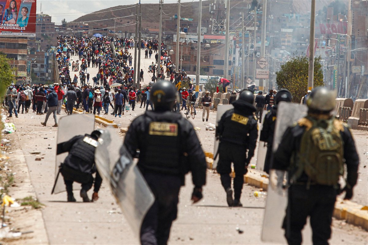 <i>Juan Carlos Cisneros/AFP/Getty Images</i><br/>Supporters of ousted president Pedro Castillo clash with police forces in the Peruvian Andean city of Juliaca on January 7.