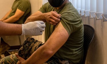 A US Marine prepares to receive the Moderna coronavirus vaccine at Camp Hansen in April of 2021