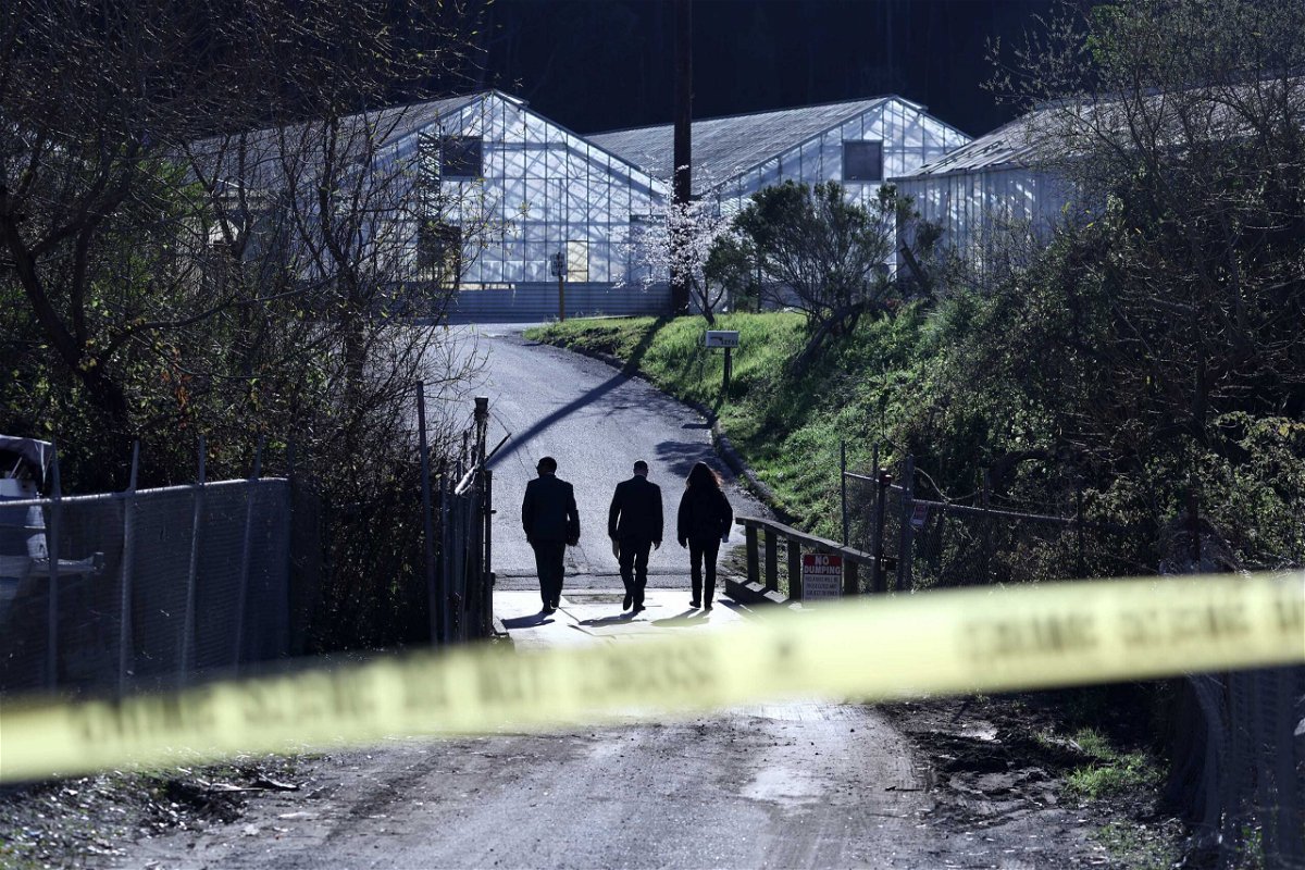 <i>Justin Sullivan/Getty Images</i><br/>FBI agents arrive at one of two farms where seven people were killed in Half Moon Bay