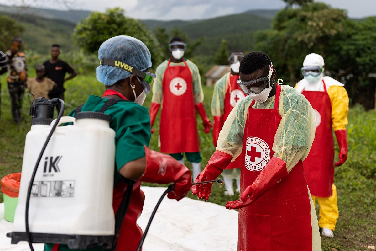 <i>Luke Dray/Getty Images</i><br/>Ugandan Red Cross workers in Mubende