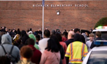 Students and police gather outside of Richneck Elementary School after a shooting on January 6 in Newport News