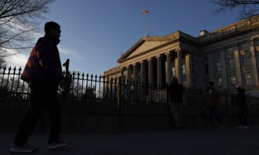 Joggers run past the Treasury Department on January 18