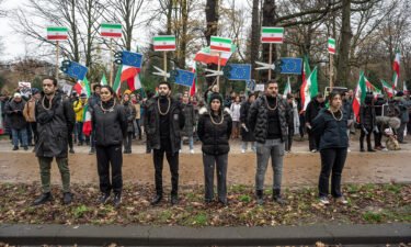 Protesters with a noose around their necks during a demonstration in The Hague on December 21. The protest called on the Dutch House of Representatives to close the Iranian embassy and to expel its diplomats.