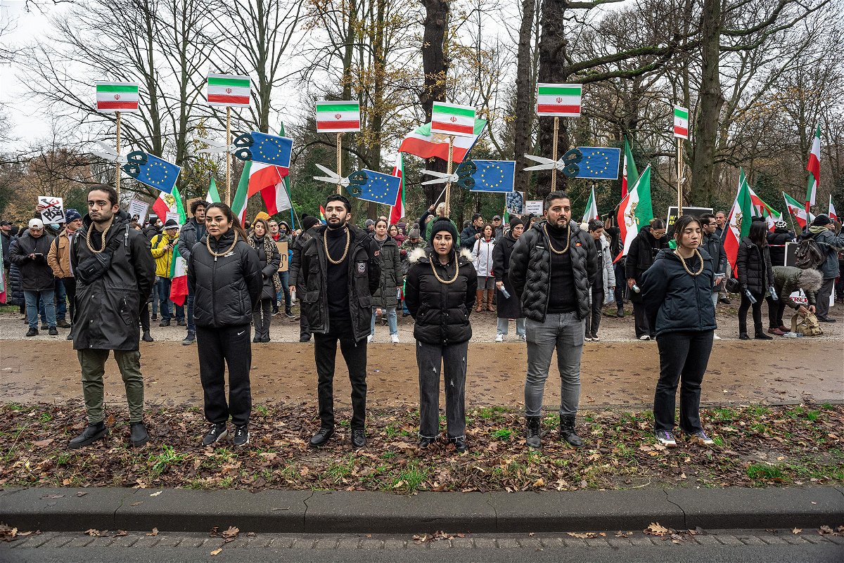 <i>Charles M. Vella/SOPA Images/LightRocket/Getty Images</i><br/>Protesters with a noose around their necks during a demonstration in The Hague on December 21. The protest called on the Dutch House of Representatives to close the Iranian embassy and to expel its diplomats.
