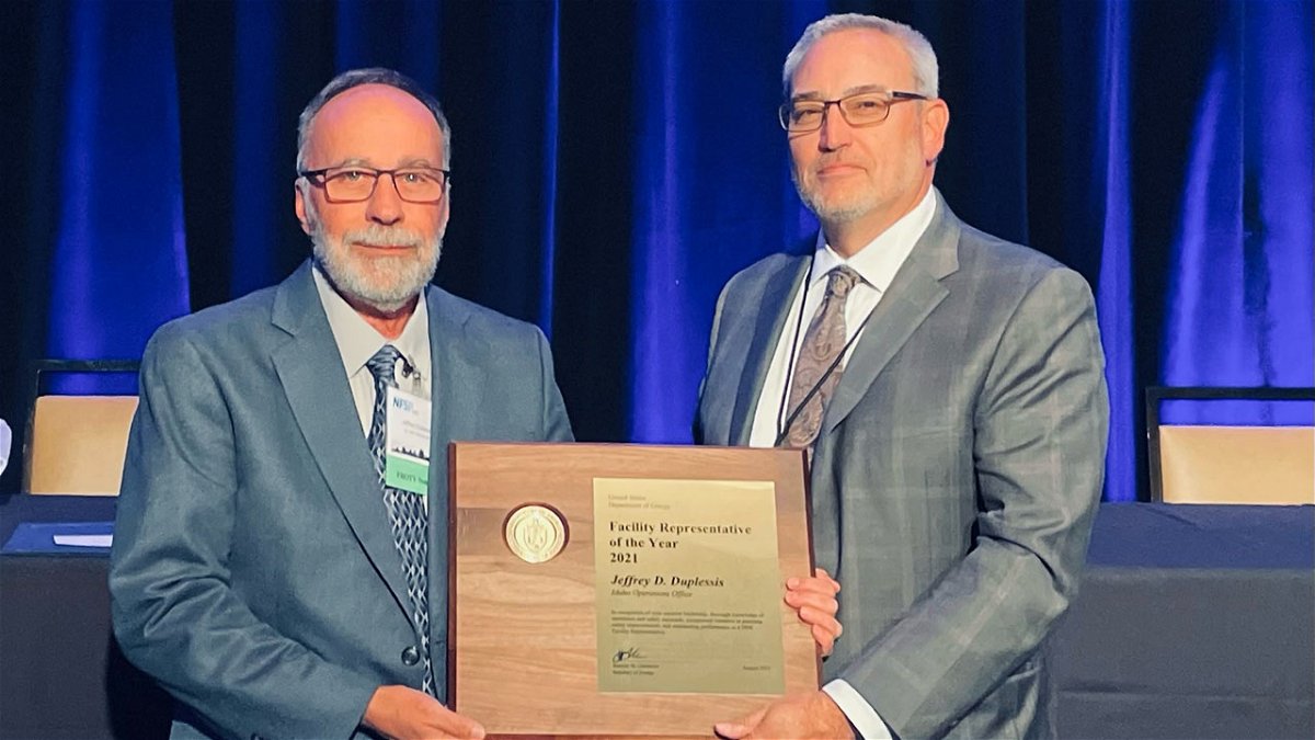Jeff Duplessis (left) receives the 2021 Facility Representative of the Year award from Todd Lapointe, Director of  the U.S. Department of Energy (DOE) Office of Environment, Health, Safety and Security (EHSS).