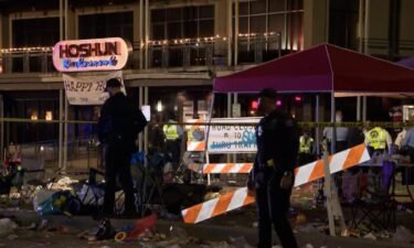 Police said five people were shot along a Mardi Gras parade route in New Orleans. A suspect is in custody.