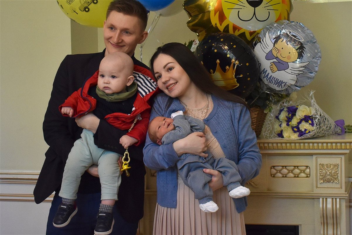 <i>Courstesy Mikhail Manzurin</i><br/>Mikhail and Nailia Manzurin pose with their two children