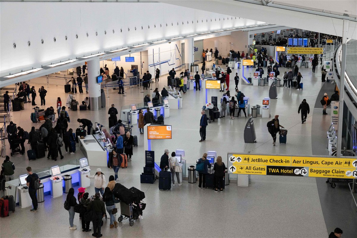 <i>Yuki Iwamura/AFP/Getty Images</i><br/>A power outage is disrupting flights at a John F. Kennedy airport international (JFK) terminal on Thursday . Pictured are travelers at JFK airport in January.