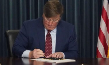 Mississippi GOP Gov. Tate Reeves signs a bill to ban gender-affirming care in the state for anyone younger than 18