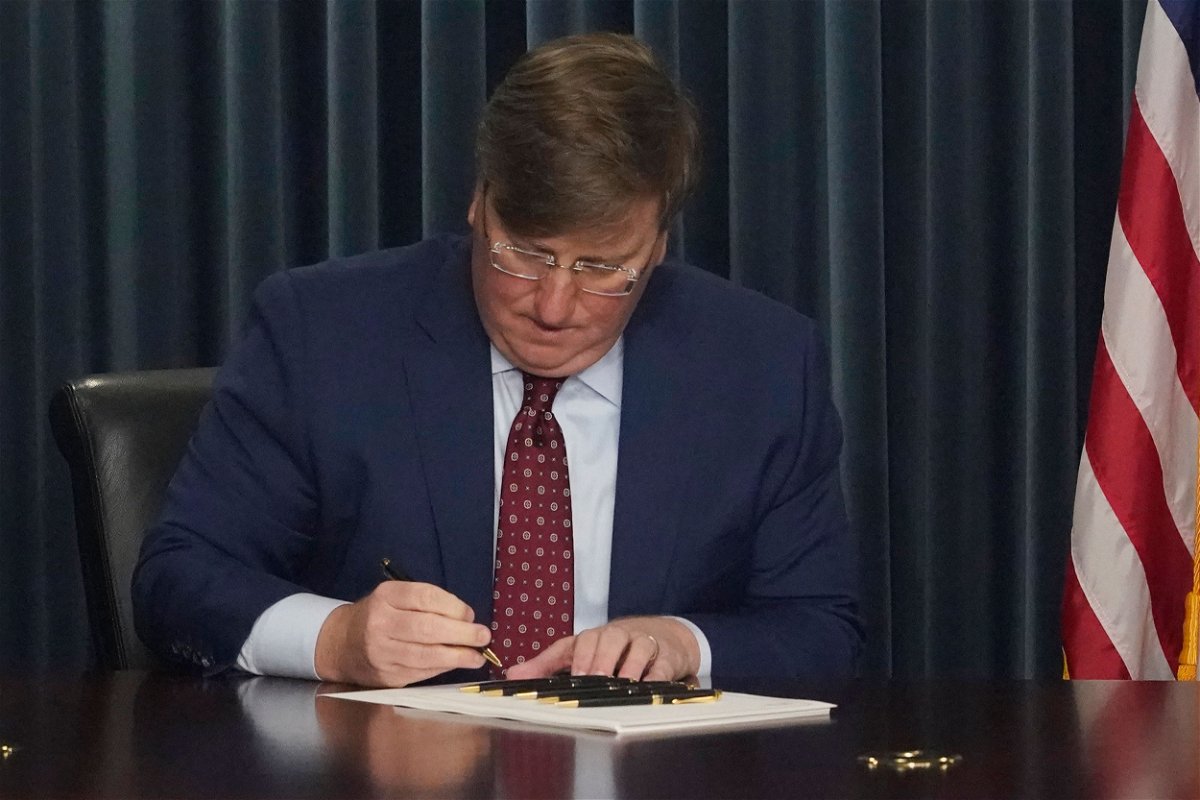 <i>Rogelio V. Solis/AP</i><br/>Mississippi GOP Gov. Tate Reeves signs a bill to ban gender-affirming care in the state for anyone younger than 18