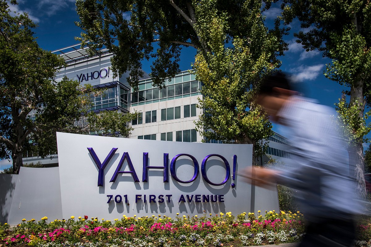 <i>David Paul Morris/Bloomberg/Getty Images</i><br/>A man walks past Oath Inc. Yahoo! signage displayed at the company's headquarters in Sunnyvale