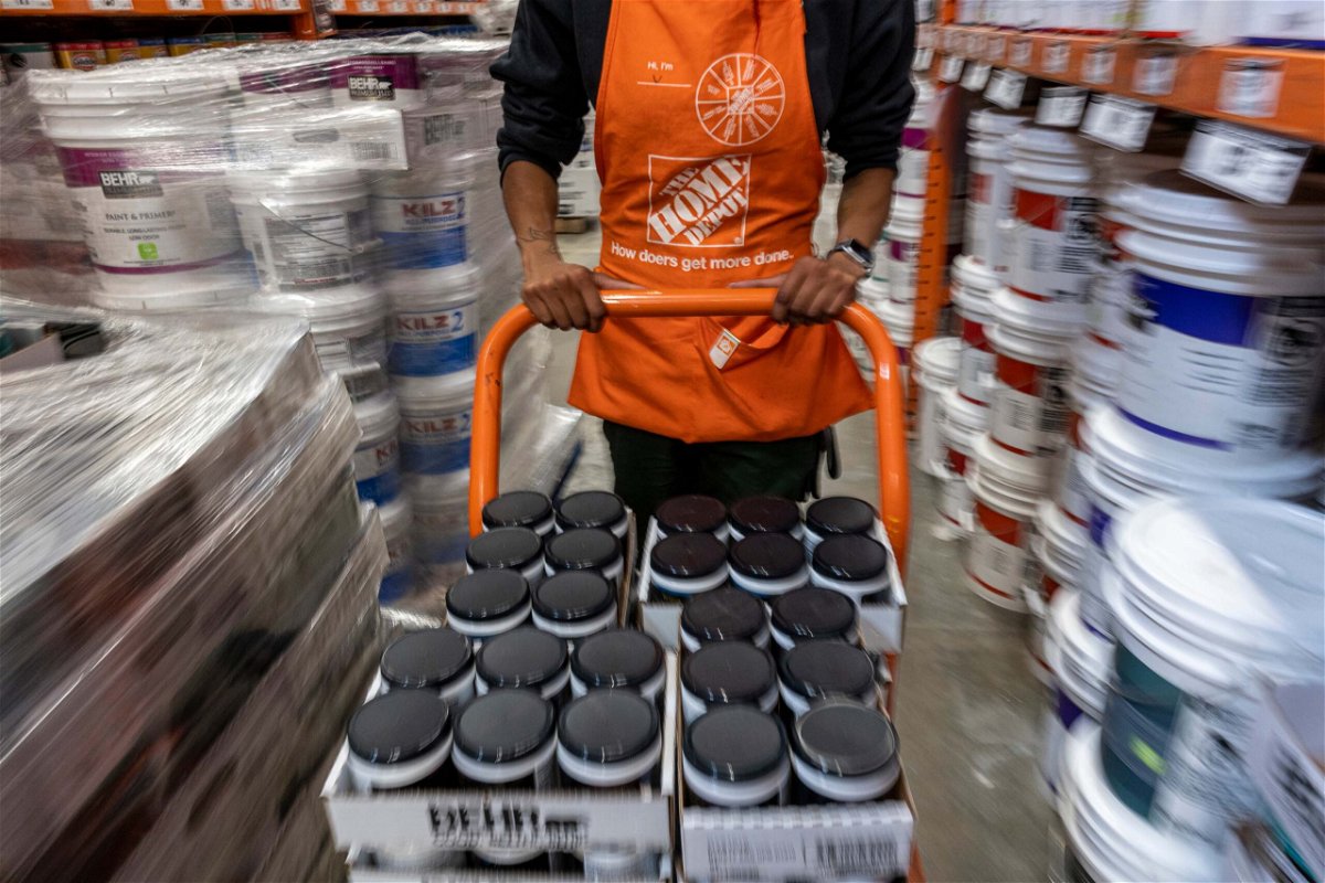 <i>David Paul Morris/Bloomberg/Getty Images</i><br/>Home Depot said it will increase pay and benefits for front line hourly staff by $1 billion this year. Pictured is an employee at a Home Depot store in Livermore