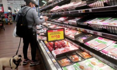 American consumers felt much worse about the US economy in February. A person shops in the beef section of a supermarket on February 13
