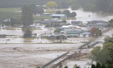 The Waiohiki bridge on the Tutaekuri River is washed away and houses flooded on February 14 in Napier