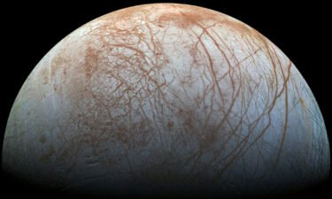 Jupiter's moon Europa hosts a subsurface ocean beneath a thick shell of ice