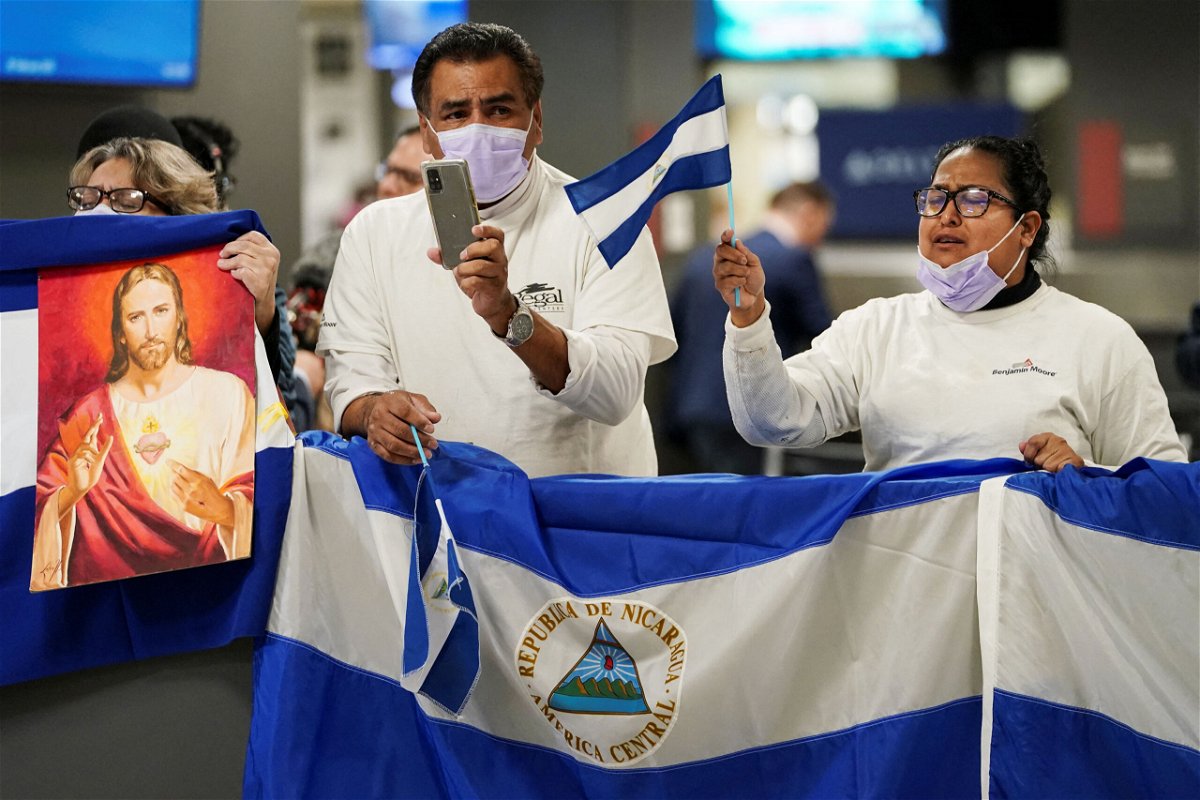 <i>Kevin Lamarque/Reuters</i><br/>Activists await the arrival of some of the more than 200 political prisoners from Nicaragua at Dulles International Airport.