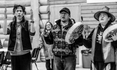 Williams Lake First Nation tribal members celebrate with Nuxalkmc through song