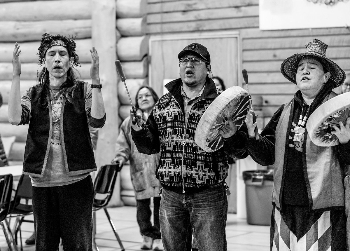 <i>Courtesy Julie Palmantier</i><br/>Williams Lake First Nation tribal members celebrate with Nuxalkmc through song