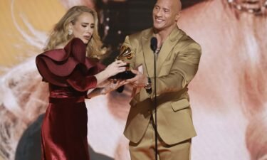 Adele accepts the Best Pop Solo Performance award for "Easy On Me" from Dwayne Johnson.