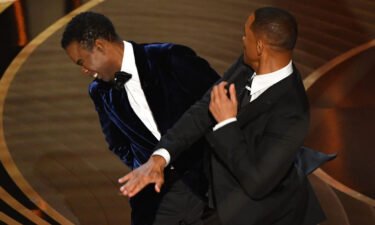 US actor Will Smith (R) slaps US actor Chris Rock onstage during the 94th Oscars at the Dolby Theatre in Hollywood