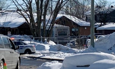 Police secure the scene where a bus crashed into a day care center on February 8.