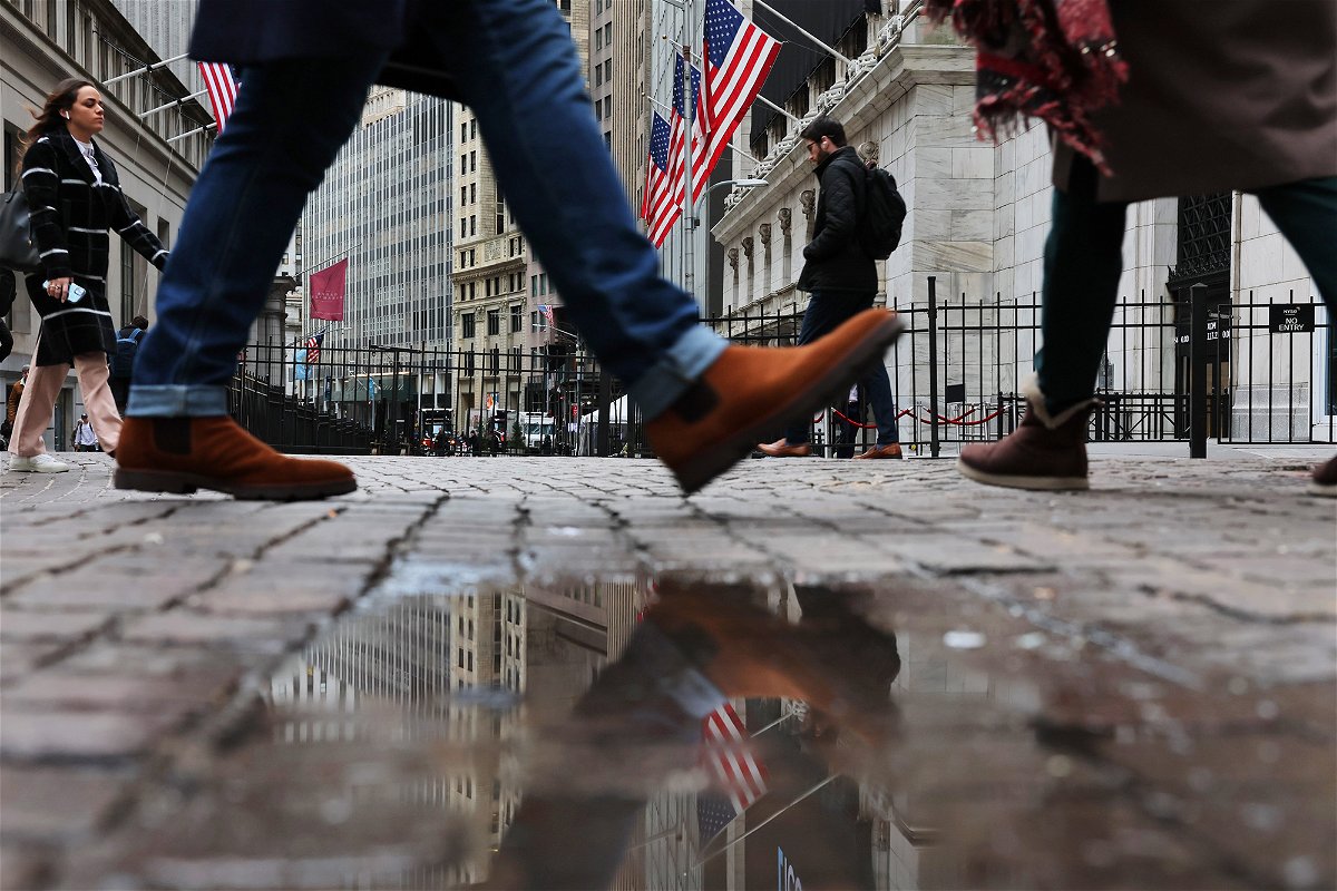 <i>Michael M. Santiago/Getty Images</i><br/>People walk past the New York Stock Exchange (NYSE) during morning trading on January 26