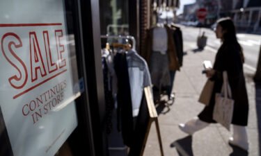 US retail sales surged in January. A shop holds a sidewalk sale
