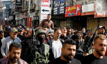 Mourners take part in the funeral of Palestinians who were killed in an Israeli raid in Jenin