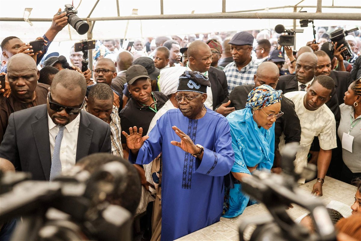 <i>John Wessels/AFP/Getty Images</i><br/>All Progressives Congress (APC) presidential candidate Bola Tinubu (C-L) and his wife Oluremi Tinubu (C-R) arrive to vote at a polling station in Lagos on February 25