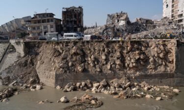Turkey's stock market soared Wednesday as the government steps in to boost stock buying after the earthquake. Pictured is earthquake damage in Hatay