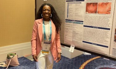 Seun Adebagbo presenting her poster presentation as a first author at an international symposium and annual meeting of the American Academy of Facial Plastic and Reconstructive Surgery.