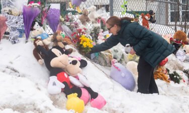 Mourners placed flowers and stuffed animals at the site of the crash.